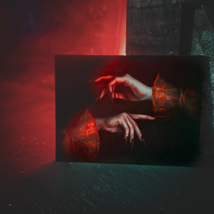 Close-up of a hand with red lighting on a textured surface