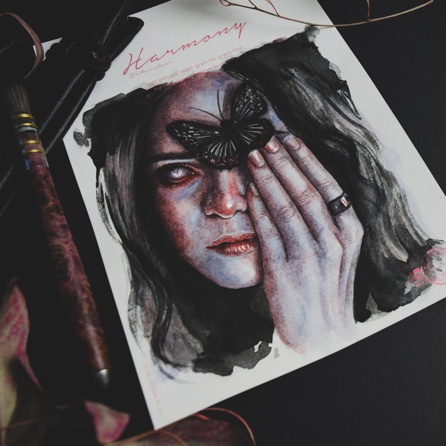 Artistic illustration of a woman with a butterfly on her face, surrounded by artistic tools.