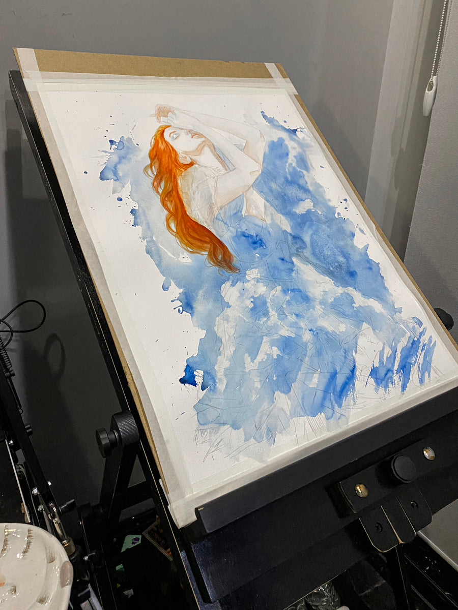 Artistic depiction of a woman with red hair on a white background, framed in a dark easel.