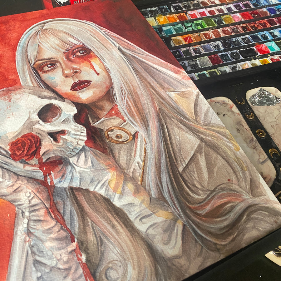 Artistic illustration of a woman with a skull and red rose, surrounded by art supplies.