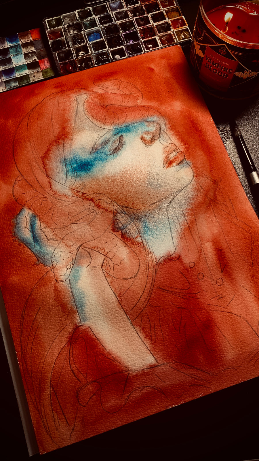 Watercolor painting of a woman with closed eyes wearing a red dress, with a red and black snake coiled around her head and hand, dark gothic art print